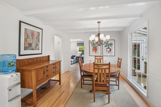 86 Lorma Ave, Trumbull, CT 06611 - dining space featuring light wood finished floors, beam ceiling, and a chandelier