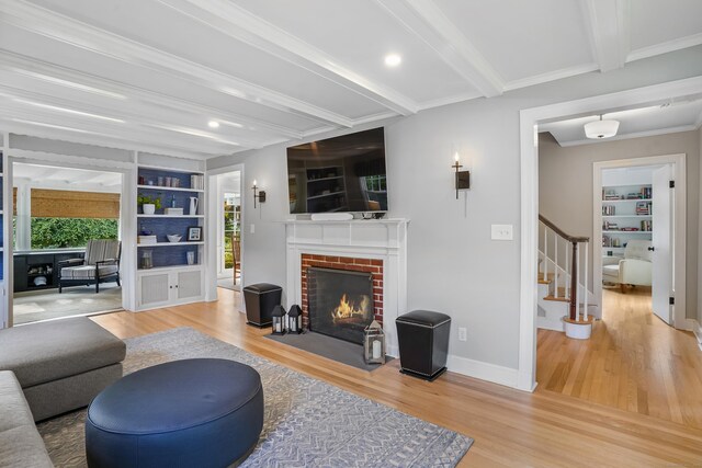 86 Lorma Ave, Trumbull, CT 06611 - living area featuring beamed ceiling, built in shelves, wood finished floors, stairway, and recessed lighting