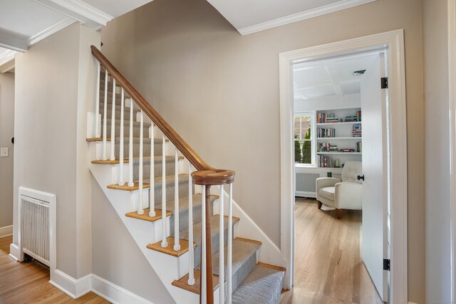 86 Lorma Ave, Trumbull, CT 06611 - stairs with radiator heating unit, wood finished floors, crown molding, and coffered ceiling