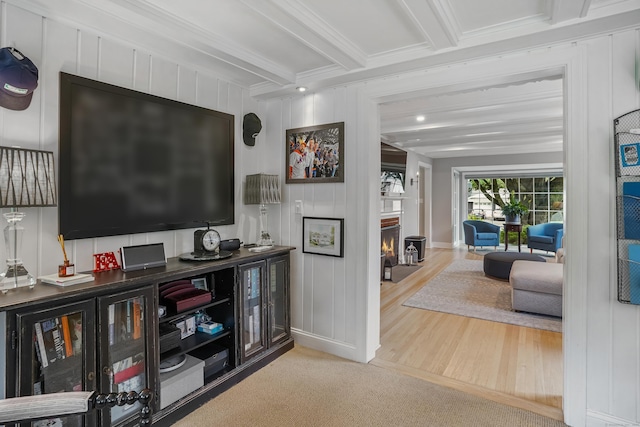 86 Lorma Ave, Trumbull, CT 06611 - living room featuring beamed ceiling, crown molding, a bar, a fireplace with flush hearth, and wood finished floors