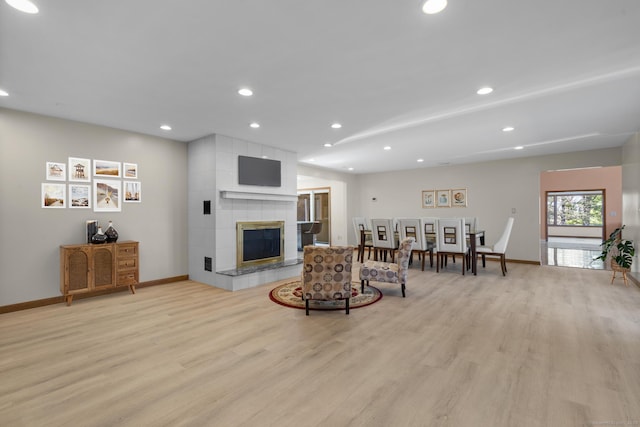48 Powers Rd, Wallingford, CT 06492 - living area featuring light wood finished floors, recessed lighting, and a fireplace