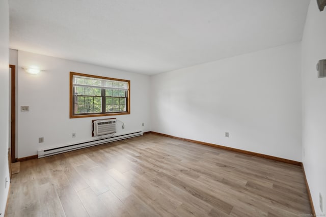 143 Pine Hill Rd Unit 9F, Thomaston, CT 06787 - empty room with baseboard heating, light wood-style flooring, baseboards, and a wall unit AC