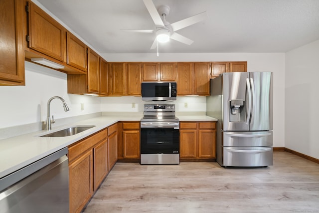 143 Pine Hill Rd Unit 9F, Thomaston, CT 06787 - kitchen with stainless steel appliances, a sink, light countertops, and light wood-style flooring