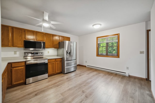 143 Pine Hill Rd Unit 9F, Thomaston, CT 06787 - kitchen with appliances with stainless steel finishes, a baseboard heating unit, brown cabinetry, light countertops, and light wood-style flooring
