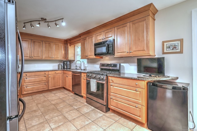51 Crestwood Rd, Milford, CT 06460 - kitchen with appliances with stainless steel finishes, light tile patterned flooring, a sink, and dark stone counters