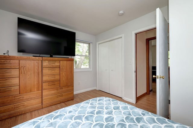 51 Crestwood Rd, Milford, CT 06460 - bedroom with light wood-style flooring, baseboards, and a closet