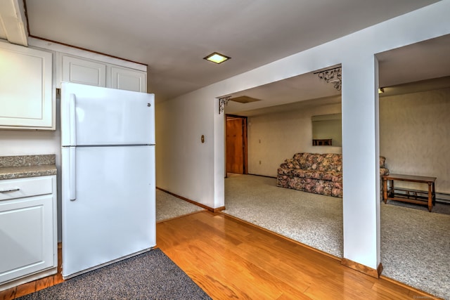 51 Crestwood Rd, Milford, CT 06460 - kitchen with freestanding refrigerator, white cabinets, light wood-style flooring, and baseboards