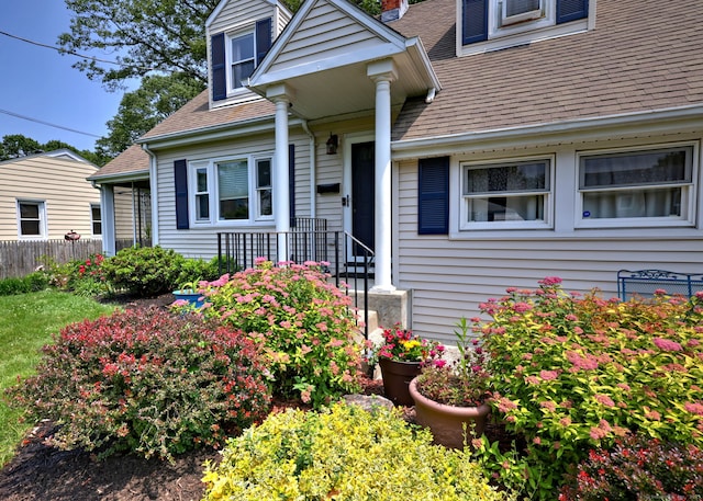 97 Richmond Ave, West Haven, CT 06516 - doorway to property with roof with shingles