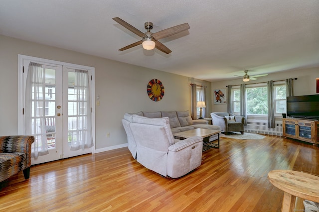 97 Richmond Ave, West Haven, CT 06516 - living area featuring radiator, a ceiling fan, light wood-style floors, and french doors
