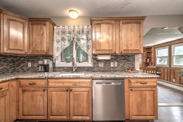 97 Richmond Ave, West Haven, CT 06516 - kitchen featuring stainless steel dishwasher, backsplash, and light stone counters