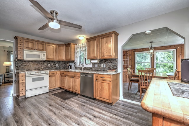 97 Richmond Ave, West Haven, CT 06516 - kitchen featuring white appliances, wood finished floors, ceiling fan, tasteful backsplash, and a textured ceiling