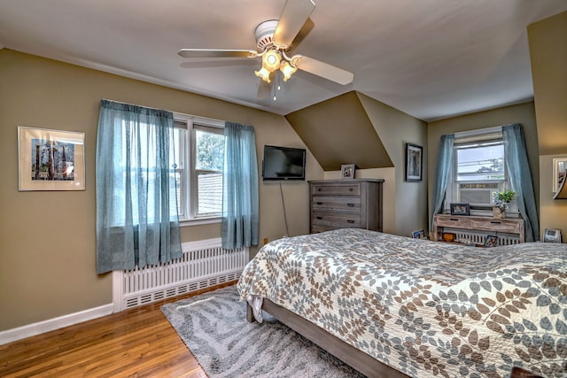 97 Richmond Ave, West Haven, CT 06516 - bedroom with radiator, multiple windows, wood finished floors, and a ceiling fan