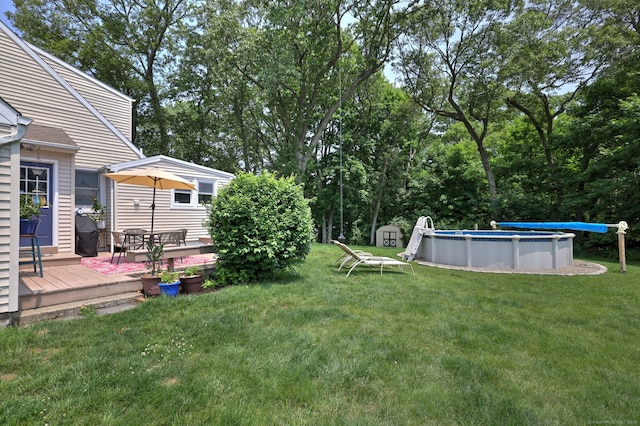 97 Richmond Ave, West Haven, CT 06516 - view of green lawn with a wooden deck and an outdoor pool