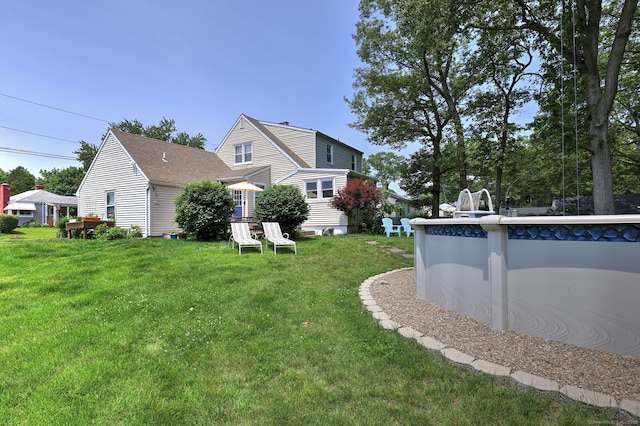 97 Richmond Ave, West Haven, CT 06516 - view of property exterior featuring an outdoor pool and a lawn