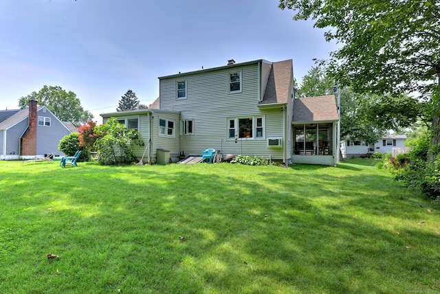 97 Richmond Ave, West Haven, CT 06516 - back of property with a sunroom, a lawn, a shingled roof, and a chimney