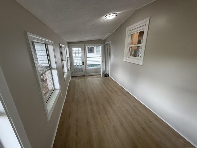28 Highland Ave, Naugatuck, CT 06770 - spare room with lofted ceiling, wood finished floors, and a textured ceiling