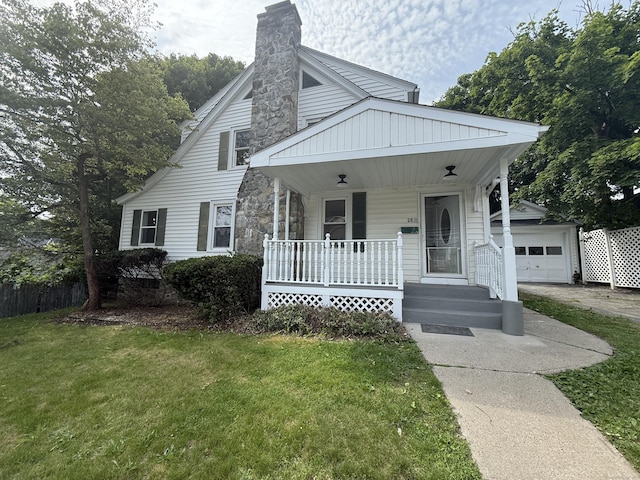28 Highland Ave, Naugatuck, CT 06770 - bungalow featuring a porch, a front lawn, a chimney, a garage, and an outbuilding