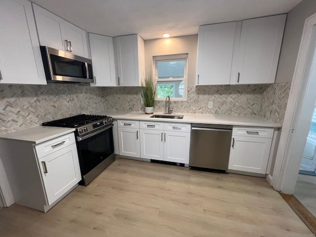 28 Highland Ave, Naugatuck, CT 06770 - kitchen featuring stainless steel appliances, light countertops, white cabinetry, and recessed lighting