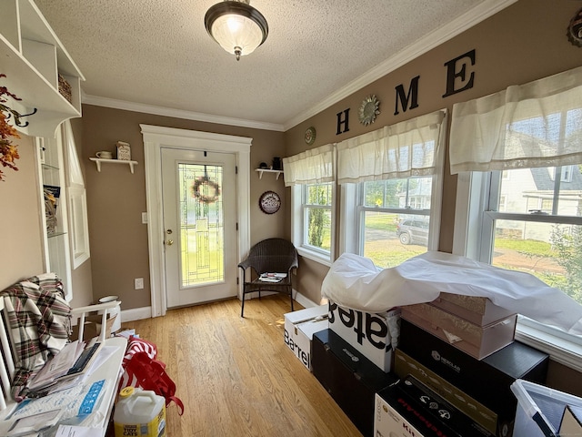 451 Robbins Ave, Newington, CT 06111 - entryway featuring a textured ceiling, light wood-type flooring, baseboards, and crown molding