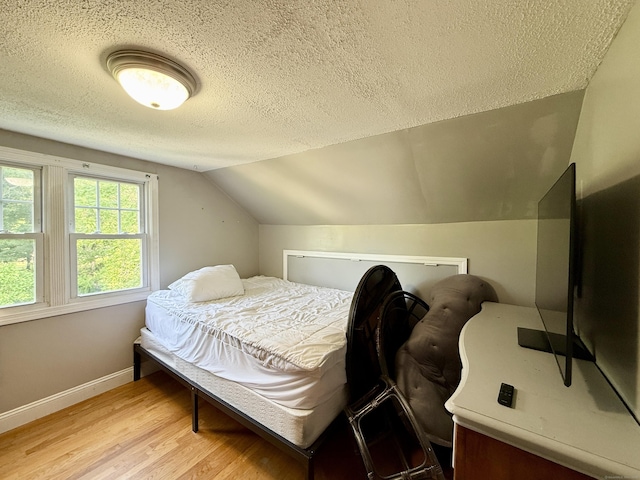 451 Robbins Ave, Newington, CT 06111 - bedroom with a textured ceiling, wood finished floors, baseboards, and vaulted ceiling
