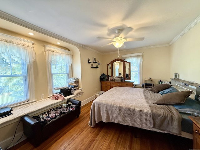451 Robbins Ave, Newington, CT 06111 - bedroom with multiple windows, hardwood / wood-style flooring, crown molding, ceiling fan, and baseboards