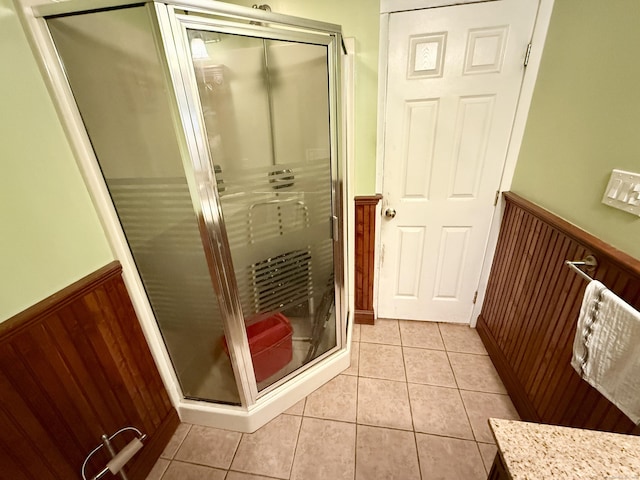 451 Robbins Ave, Newington, CT 06111 - bathroom with a wainscoted wall, tile patterned flooring, and a stall shower