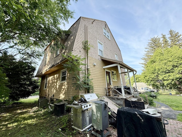 451 Robbins Ave, Newington, CT 06111 - view of property exterior featuring a gambrel roof and cooling unit
