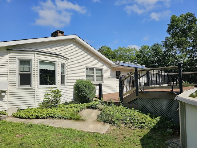 105 Minortown Rd, Woodbury, CT 06798 - view of side of property with a wooden deck and a chimney