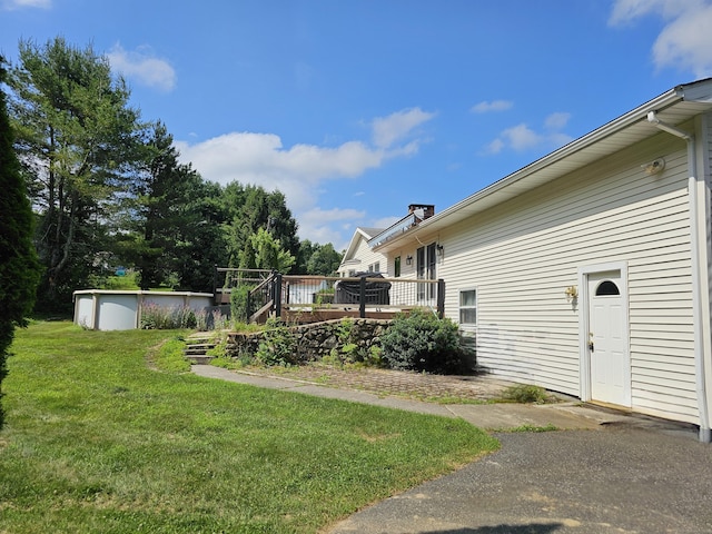 105 Minortown Rd, Woodbury, CT 06798 - view of grassy yard with a deck and an outdoor pool
