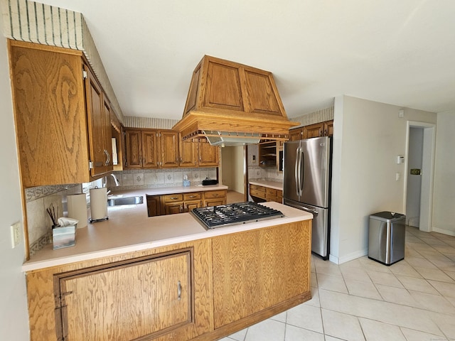 105 Minortown Rd, Woodbury, CT 06798 - kitchen with appliances with stainless steel finishes, a peninsula, light countertops, light tile patterned floors, and decorative backsplash