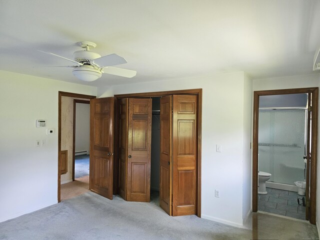 105 Minortown Rd, Woodbury, CT 06798 - unfurnished bedroom with a baseboard heating unit, a closet, light colored carpet, connected bathroom, and ceiling fan