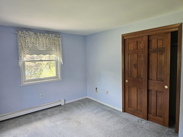 105 Minortown Rd, Woodbury, CT 06798 - unfurnished bedroom with a baseboard heating unit, carpet floors, and a closet