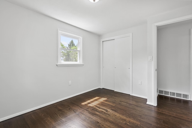 22 Allerton Rd, Naugatuck, CT 06770 - unfurnished bedroom featuring dark wood-style floors, a closet, and baseboards