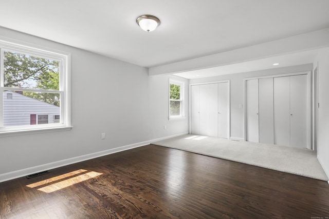 22 Allerton Rd, Naugatuck, CT 06770 - unfurnished bedroom with two closets, baseboards, and wood finished floors