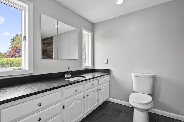 22 Allerton Rd, Naugatuck, CT 06770 - bathroom featuring vanity, healthy amount of natural light, toilet, and baseboards