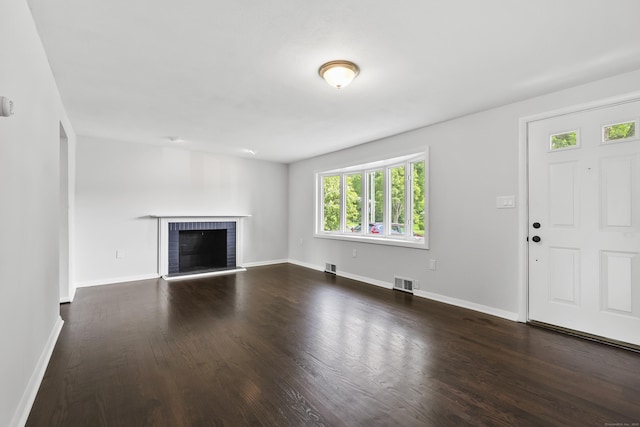 22 Allerton Rd, Naugatuck, CT 06770 - unfurnished living room featuring dark wood-style flooring, baseboards, and a brick fireplace