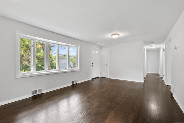 22 Allerton Rd, Naugatuck, CT 06770 - unfurnished living room featuring dark wood-style flooring and baseboards