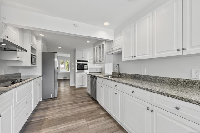22 Allerton Rd, Naugatuck, CT 06770 - kitchen featuring stainless steel appliances, a sink, white cabinetry, light wood-style floors, and recessed lighting