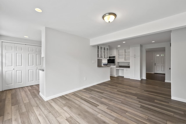 22 Allerton Rd, Naugatuck, CT 06770 - unfurnished living room with recessed lighting, dark wood finished floors, and baseboards