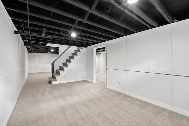22 Allerton Rd, Naugatuck, CT 06770 - finished below grade area featuring stairway, carpet flooring, and a decorative wall