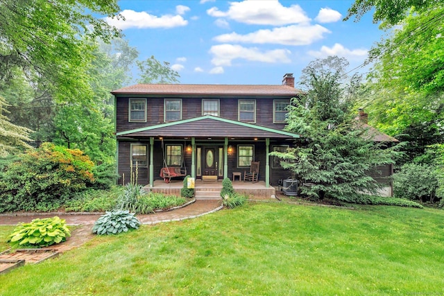 136 Wheeler Rd, Monroe, CT 06468 - view of front of house with a porch, a front lawn, and a chimney