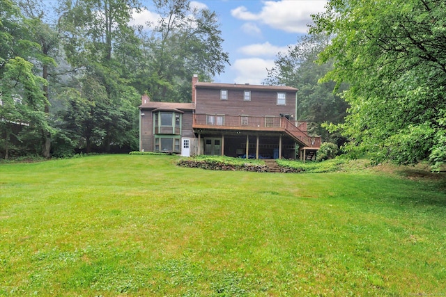 136 Wheeler Rd, Monroe, CT 06468 - back of house with a chimney, a deck, a lawn, and stairs