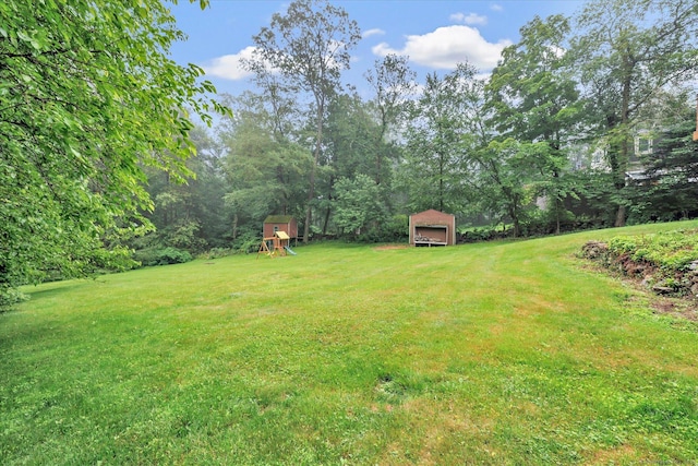 136 Wheeler Rd, Monroe, CT 06468 - view of green lawn featuring a playground and an outdoor structure