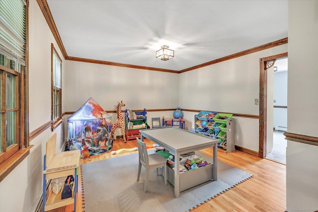 136 Wheeler Rd, Monroe, CT 06468 - game room featuring wood finished floors, crown molding, and baseboard heating