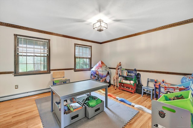136 Wheeler Rd, Monroe, CT 06468 - recreation room featuring wood finished floors, a baseboard heating unit, and ornamental molding