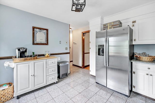 136 Wheeler Rd, Monroe, CT 06468 - kitchen with stainless steel fridge with ice dispenser, white cabinetry, and light countertops