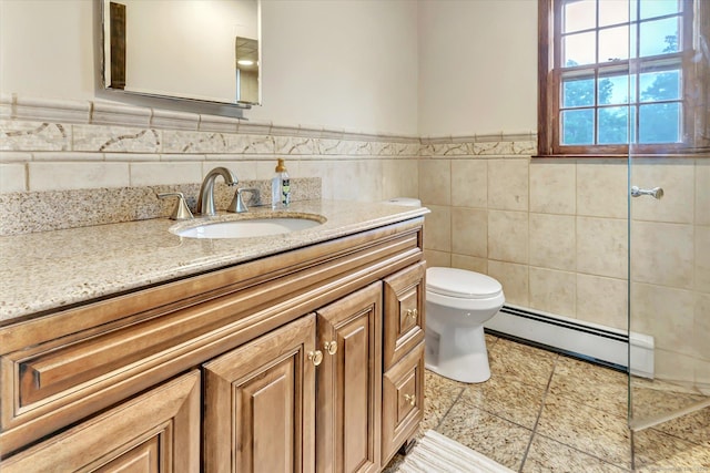 136 Wheeler Rd, Monroe, CT 06468 - full bathroom with a baseboard radiator, vanity, tile walls, wainscoting, and tile patterned flooring