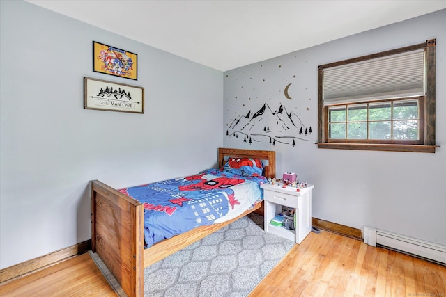 136 Wheeler Rd, Monroe, CT 06468 - bedroom with a baseboard heating unit and wood finished floors