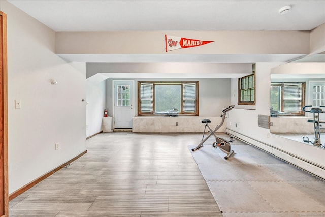 136 Wheeler Rd, Monroe, CT 06468 - exercise area with light wood-style flooring and a baseboard heating unit