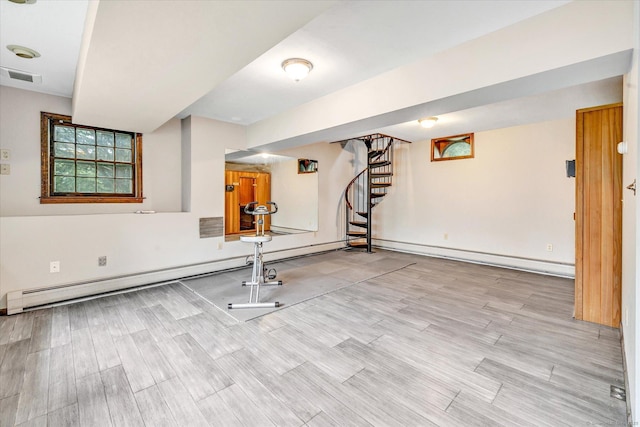 136 Wheeler Rd, Monroe, CT 06468 - exercise room featuring a baseboard heating unit and wood finished floors